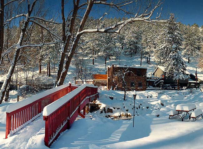 Snow covered creek at A-Lodge in Boulder, Colorado