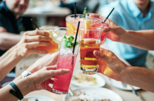 Photo of a group having drinks at a restaurant in Boulder while staying at the A-Lodge hotel.