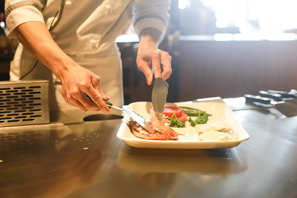 Photo of a chef preparing a dinner at a restaurant in Boulder, Colorado.