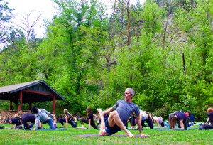 Yoga Teacher Rob Loud Teaching An Outdoor Yoga Class in Boulder, Colorado