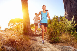 Couple running on the Arkansas Hills trail system near Salida, CO
