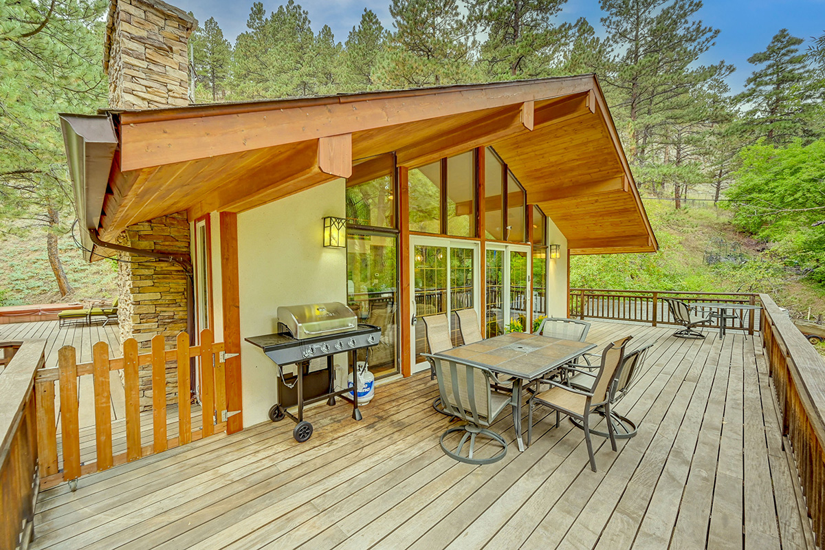 Deck with grill at the A-Chalet home rental in Boulder, CO