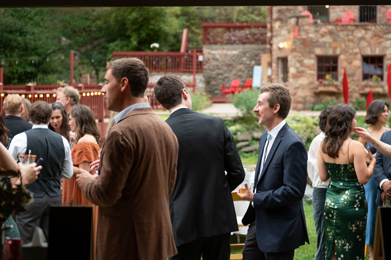 Guests enjoying cocktail hour at A-Lodge Boulder Colorado destination wedding venue