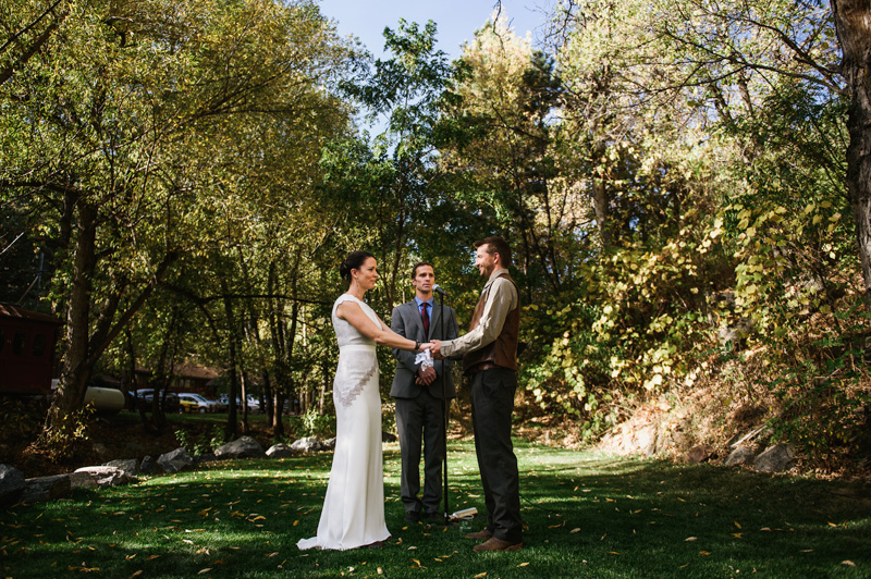Intimate outdoor destination wedding ceremony at A-Lodge Boulder Colorado in Boulder Canyon