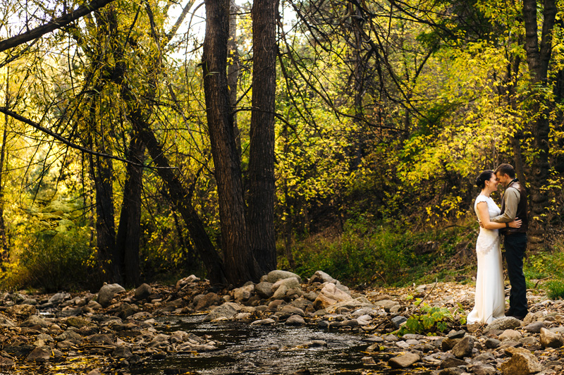 Creekside destination wedding portrait at A-Lodge Boulder Colorado surrounded by forest and mountain canyon