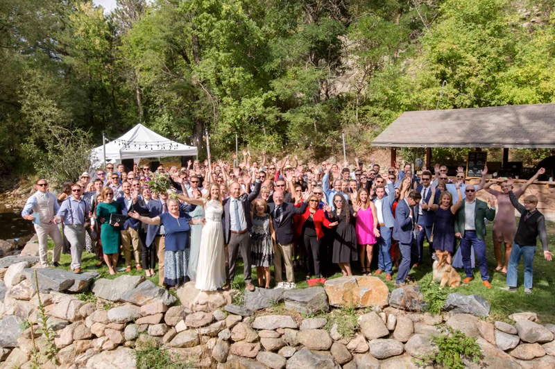 Destination wedding celebration at A-Lodge Boulder Colorado with couple and guests gathered in Boulder Canyon