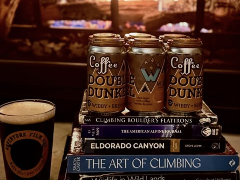 climbing guide books and a 6 pack of beer