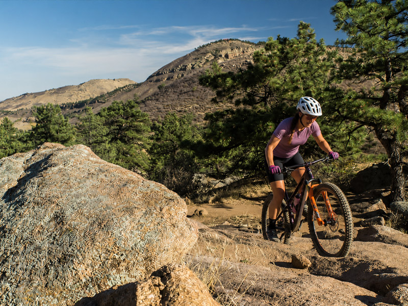 Woman mountain biking on the Hall Ranch trails in Lyons Colorado